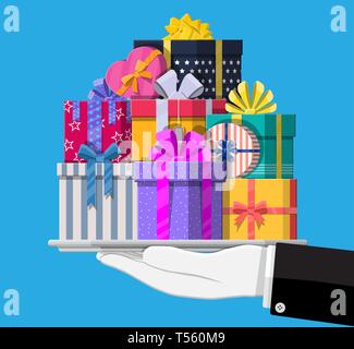 Gift boxes in hand. Colorful wrapped. Sale, shopping. Present boxes different sizes with bows and ribbons. Collection for birthday and holiday. Vector Stock Vector