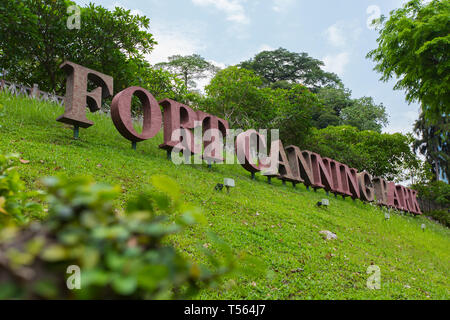 A low and side angle image of big signage indicating the name of Fort Canning Park on a steep slope, Singapore. Stock Photo