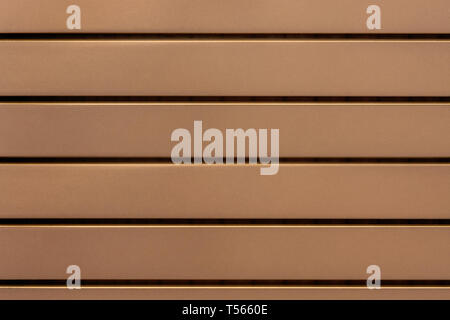 Fragment of a lattice of wooden slats brown for use as a background. Stock Photo