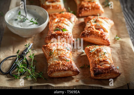 Hot sausage in puff pastry as a snack for breakfast Stock Photo