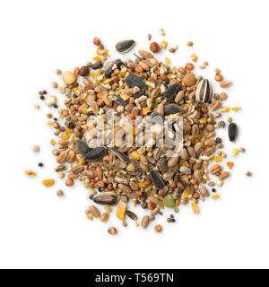 Heap of bird food mixture  isolated on white background Stock Photo