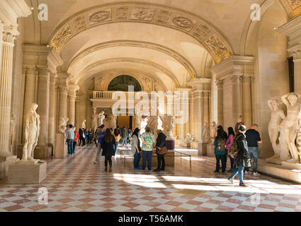 Paris, France - March 31, 2019: Visitors Walking the Louvre museum Stock Photo