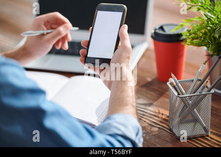 Manager using smartphone Stock Photo