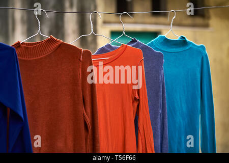 Hanging clothes drying on asian street outdoors Stock Photo