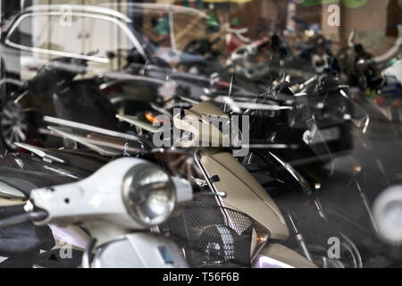 Motorbike store with panoramic windows with traffic reflection Stock Photo