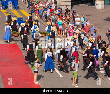 Zurich, Switzerland - August 1, 2018: participants of the parade devoted to the Swiss National Day passing Uraniastrasse street in the city of Zurich. Stock Photo