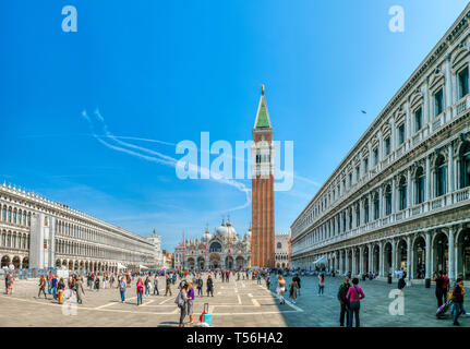 Venice, Italy, April 17 2019: St Mark's Square in Venice, Italy, Piazza San Marco in Venezia with the Basilica and bell tower attracts tourists from