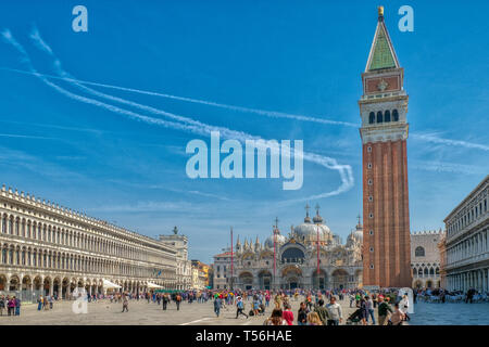 Venice, Italy, April 17 2019: St Mark's Square in Venice, Italy, Piazza San Marco in Venezia with the Basilica and bell tower attracts tourists from