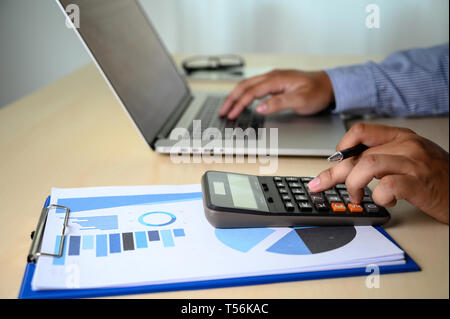 man Hands typing on computer laptop desktop with female hands working on modern laptop Stock Photo