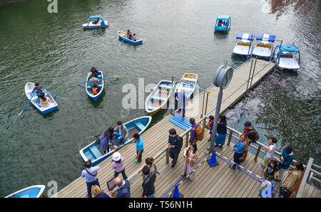 Tokyo, Japan - Apr 7, 2019. People waiting for wooden boat at tourist pier of Chidorigafuchi Park in Tokyo, Japan. Stock Photo
