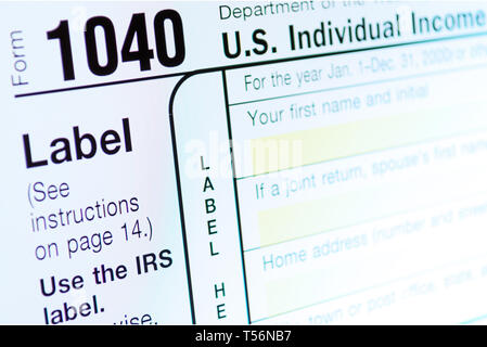 Income Tax Return Deduction Form 1040 on Computer Monitor. Refund Concept. Copy space for your text Stock Photo