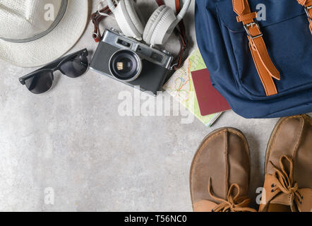prepare backpack accessories and travel items on marble background, flat lay, top view background Stock Photo