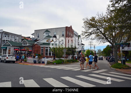 Tourists walk past the rustic shops of downtown Manteo on the Outer Bank's Roanoke Island, North Carolina. Stock Photo