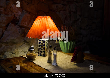 Restaurant table light with salt and pepper and napkins Stock Photo
