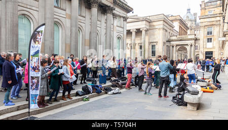 Singers and musicians from the Nevis Ensemble, 'Scotland's Street Orchestra' performing in Royal Exchange Square, Glasgow, Scotland, UK Stock Photo