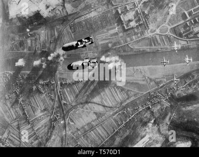An attack of USAAF Martin B-26 Marauder bombers on the railroad bridge across the Moselle River at Trier-Pfalzel, Rhineland-Palatinate, Germany, Dec. 24, 1944 Stock Photo