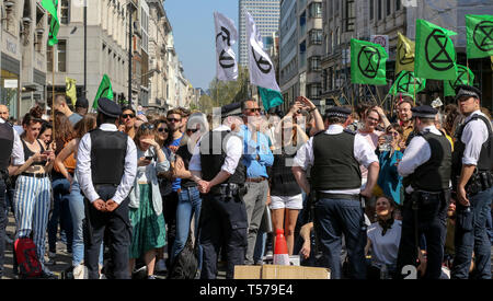 London, UK, UK. 19th Apr, 2019. Environmental activists are seen at the Oxford Circus during the fifth day of the climate change protest by the Extinction Rebellion movement group.A large number of police presence around the pink yacht as they un-bond the activists who glued themselves and the police prepares to remove them from the site. According to the Met Police, over 1000 activists have been arrested since the demonstration started on 11 April 2019. Credit: Dinendra Haria/SOPA Images/ZUMA Wire/Alamy Live News