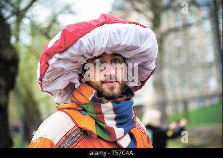 A protester seen wearing a mushroom hat 
