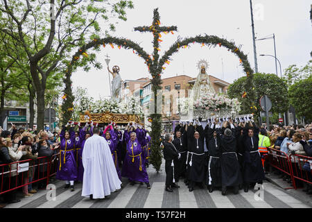 Mostoles, Madrid, Spain. 21st Apr, 2019. The images of Resurrected Christ and Virgin Mary seen crossing a double rosemary arch decorated with oranges, lemons and the Spanish flag during the traditional procession of Easter Sunday.The procession has been celebrated since the 18th century and is a tourist attraction in the region. Christian believers around the world mark the Holy Week of Easter celebrating the crucifixion and resurrection of Jesus Christ. Credit: Legan P. Mace/SOPA Images/ZUMA Wire/Alamy Live News Stock Photo