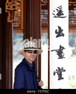 Los Angeles, USA. 21st Apr, 2019. A man visits the Chinese garden Liu Fang Yuan in the Huntington Library, Art Collections and Botanical Gardens in Los Angeles, the United States, April 21, 2019. Inspired by Chinese gardens of Suzhou, a Chinese city renowned for its ancient gardens, Liu Fang Yuan, or the Garden of Flowing Fragrance, is one of the largest Chinese-style gardens overseas. The word 'liu fang', or 'flowing fragrance', refers to the scent of flowers and trees, including the pine, lotus, plum, and other plants found here. Credit: Li Ying/Xinhua/Alamy Live News