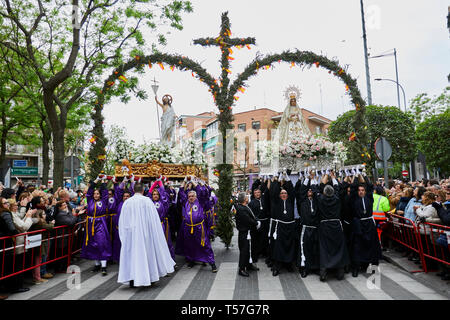 The images of Resurrected Christ and Virgin Mary seen crossing a double rosemary arch decorated with oranges, lemons and the Spanish flag during the traditional procession of Easter Sunday. The procession has been celebrated since the 18th century and is a tourist attraction in the region. Christian believers around the world mark the Holy Week of Easter celebrating the crucifixion and resurrection of Jesus Christ. Stock Photo