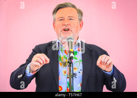 Marble Arch, London, UK. 22nd Apr, 2019. Barry Gardiner, MP, Labour Party, Member of Parliament for Brent North, speaks on stage in a brightly coloured, eco-inspired bee-and-insect design shirt.Activists once again protest largely peacefully in bright sunshine at Marble Arch. Campaigners were back at Marble Arch - the only Met-sanctioned protest space - on Monday, as activists met to plan the week ahead. The Marbe Arch site includes a large tented area for protesters to sleep and rest. Credit: Imageplotter/Alamy Live News Stock Photo