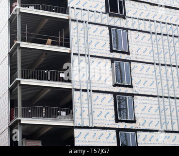 Insulation panels and double glazed windows on exterior wall of ...