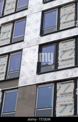 Insulation panels and double glazed windows on exterior wall of ...