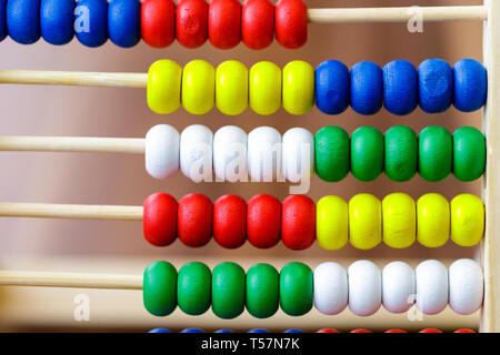 Colorful vintage style wooden abacus. For Learning Basic Mathematics Calculator - Close up. Stock Photo