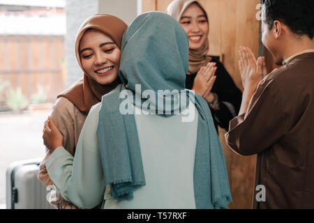 muslim family hug in eid mubarak celebration Stock Photo