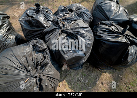 Three big blacks garbage bags full of trash Stock Photo - Alamy