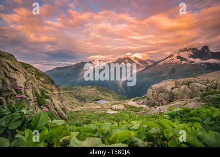 Cloudy Sunset over Iconic Mont-Blanc Mountains Range and Lake Stock Photo