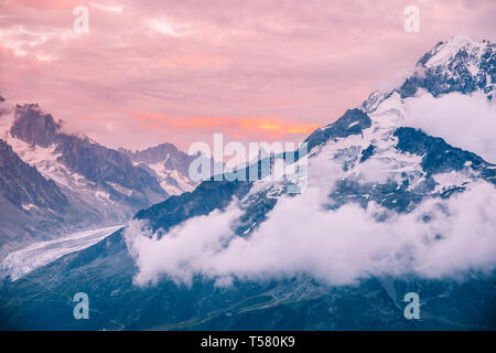 Cloudy Sunset over Iconic Mont-Blanc Mountains Range and Glaciers Stock Photo