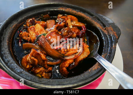 Kung Po pork is a spicy, stir-fried Chinese dish made with pork, chili  vegetables and sauce. Stock Photo