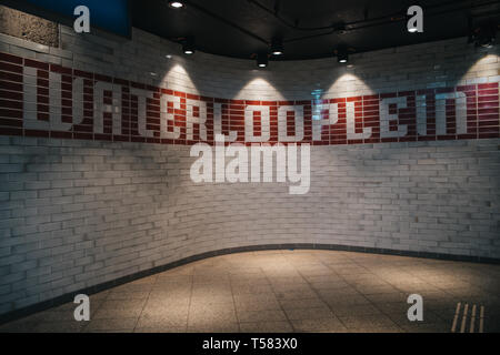 Interior of entrance to Amsterdam subway station, made of white tiles Stock Photo