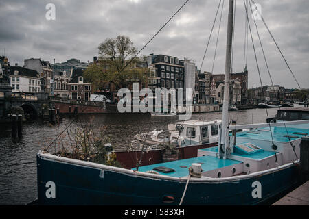 Amsterdams wharf with parked ship on european houses background Stock Photo