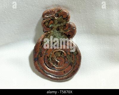 A ceramic pendant made by a local potter Stock Photo