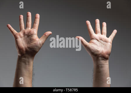 cropped hands up - man hands isolated Stock Photo