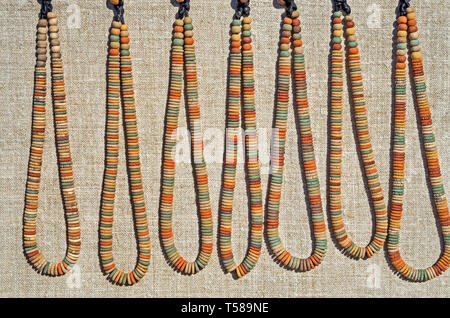 Primitive clay bead necklaces similar to those made by wild tribes in Africa Stock Photo