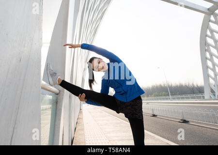 Outdoor fitness young woman Stock Photo