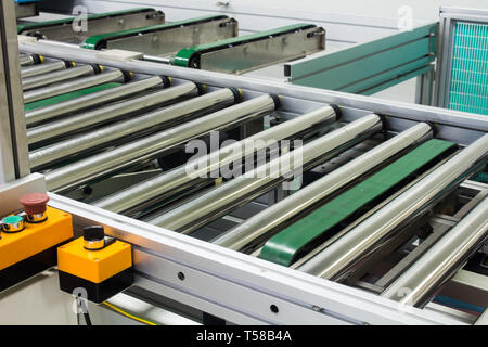 The conveyor chain, and conveyor belt on production line set up in clean room area. Stock Photo