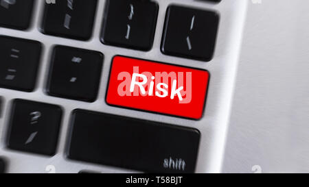 Risk word on red computer keyboard button Stock Photo
