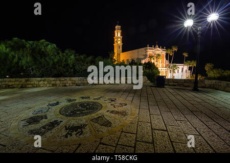 Beautiful view of Wishing Bridge in Abrasha Park with St. Peter's Church in the background during night time. Taken in Old Jaffa, Tel Aviv-Yafo, Israe Stock Photo