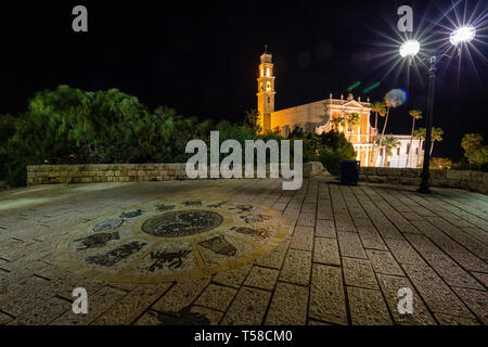 Beautiful view of Wishing Bridge in Abrasha Park with St. Peter's Church in the background during night time. Taken in Old Jaffa, Tel Aviv-Yafo, Israe Stock Photo