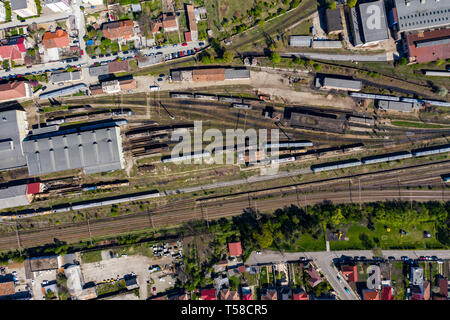 Aerial drone view of old locomotive train depo, parking iron horses on railway routes. Diesel engine Stock Photo