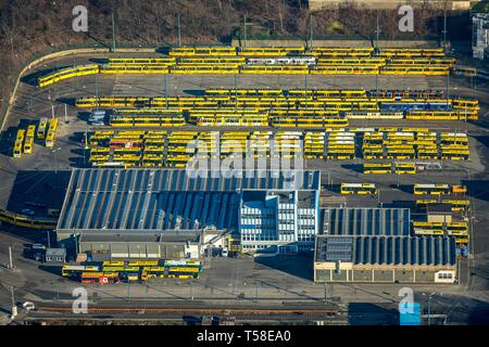 Aerial view, tram depot and bus depot, Essener Verkehrs AG, EVAG, parked vehicles in rows, yellow trams, yellow buses, Essen, North Rhine-Westphalia Stock Photo