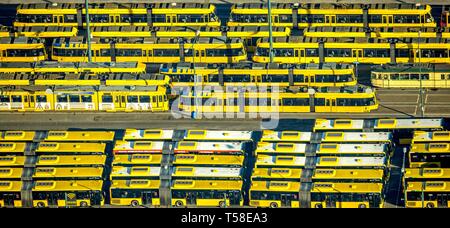 Aerial view, tram depot and bus depot, Essener Verkehrs AG, EVAG, parked vehicles in rows, yellow trams, yellow buses, Essen, North Rhine-Westphalia Stock Photo