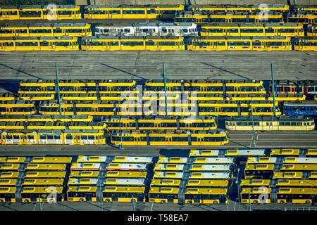 Aerial view, tram depot and bus depot, Essener Verkehrs AG, EVAG, parked vehicles in rows, yellow trams, yellow buses, Essen, North Rhine-Westphalia Stock Photo