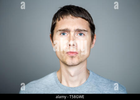 Young brunette on empty background Stock Photo