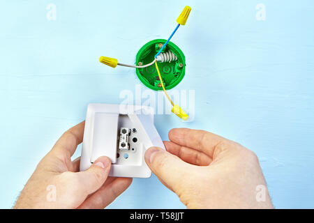 Electrical work, installation of european standard socket box, electrical switch for wall mount. Stock Photo